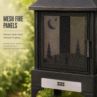 Brasero d'extérieur autoportant moderne avec panneaux en maille, foyer en acier pour bois, grille en fonte et support à bûches