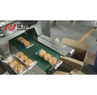 Machine d'emballage et de conditionnement automatique à flux continu pour biscuits, craquelins, gâteaux et autres produits alimentaires
