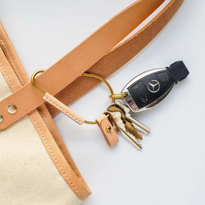 Cross-border PU <b>leather</b> brass carabiner <b>keychain</b>, simple retro pacifier stud key pendant, car <b>keychain</b> - Product Image 4