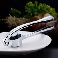 Nouveau design d'articles de cuisine professionnels Outils pour légumes Presse-ail Rocker