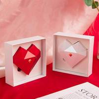 Nouvelle boîte à bijoux en plastique en forme de cœur à facettes diamantées avec ouverture automatique pour les propositions et les surprises