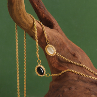 Collier en or 18 ct à double couche avec chaîne torsadée en forme de corde ovale géométrique en acrylique œil de chat
