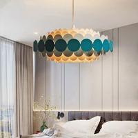 Lampe suspendue minimaliste en fer avec abat-jour en acrylique multicouche de style nordique, idéale pour restaurant et salle à manger