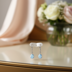 Pendientes colgantes elegantes plateados para mujer con colgante ovalado de cristal azul claro y diamantes de imitación para fiesta, estilo romántico - Product Image 2