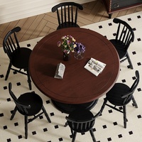 Table à manger ronde vintage en bois massif avec piétement sculpté, finition noire, style médiéval, mobilier de salle à manger pour hôtel, restaurant, villa