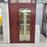 Ascenseur de cabine à porte métallique moderne à commande manuelle pour petite villa, usage domestique, marque Vectr, garantie 1 an, porte à commande manuelle