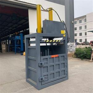 Machine d'emballage verticale en film plastique à vente chaude, petite machine <span class=keywords><strong>de</strong></span> compactage, compacteur vertical hydraulique - Product Image 1
