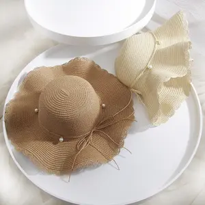 2022 nuova moda all'ingrosso promozionale cina fornitori tesa larga estate spiaggia viaggio cappello di paglia cappello con perle e fiocco