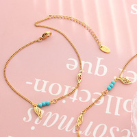 Chaîne de cheville bohème en acier inoxydable avec perles turquoise, ajustable, motif ailes d'ange ajourées, pour filles