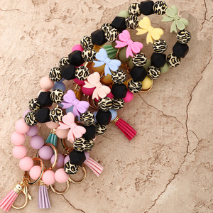 Silicone Beaded <b>Keychain</b> Bracelet With Daisy Charm And Carabiner Clasp In Pastel Colors - Product Image 5