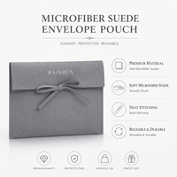 Pochette à bijoux multi-usages en microfibre grise avec fermeture à nœud en ruban, logo en feuille d'or, personnalisable OEM, pochette de rangement pour maquillage et rouge à lèvres