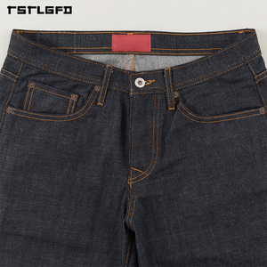 Jeans de mezclilla cruda selvedge índigo de 10.5 oz con corte y confección, ajuste original, puntada de cadena dorada, remaches de cobre y etiqueta tejida. Jeans Heritage. - Product Image 5