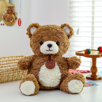 Peluche Ours Brun Adorable Coussin Confortable Compagnon de Nuit pour Vente en Gros, Cadeau, Présentation en Magasin et Décoration Intérieure