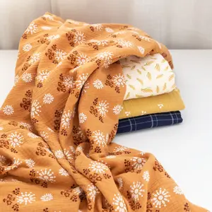 Tela de manta de muselina de gasa de doble capa con estampado floral de color soleado
