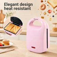 Machine à sandwich électrique compacte rose résistante à la chaleur avec double plaque, poignée verrouillable et voyant lumineux pour la cuisine domestique
