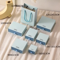 Boîte de rangement pour bijoux bleue texturée en gros, en stock, avec doublure en éponge et impression bronzée pour bagues, boucles d'oreilles, colliers - Emballage cadeau