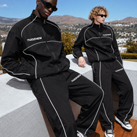 Ensemble de survêtement pour homme en nylon à col montant, avec veste de sport zippée intégrale et pantalon ample, idéal pour le voyage, avec éléments réfléchissants
