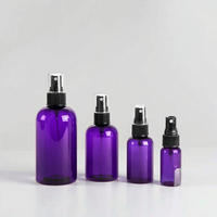 Bouteille ronde en PET violette avec pulvérisateurs à fine brume noirs pour l'emballage de shampooing, de parfum, de lotion, de crème et d'eau