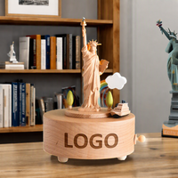 Boîte à musique Statue de la Liberté en hêtre, ronde, rotative, 18 notes, à remontoir, souvenir de New York, logo personnalisé, cadeau, vente en gros d'usine