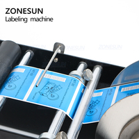 Machine d'étiquetage manuelle ZONESUN ZS-50 pour bouteilles rondes en plastique d'eau minérale, machine d'étiquetage adhésif pour bouteilles rondes