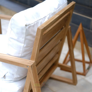 The Bali Nusa Chair showcases teak wood furniture craftsmanship ideal for outdoor spaces blending natural color elegant - Product Image 1