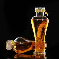 Bouteille de vin à bulles de ginseng transparente en verre borosilicate de luxe de 1000 ml avec des verrous et des couvercles métalliques pour boîte cadeau