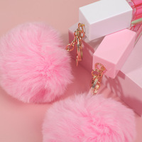 Vente en gros de marque privée 48 couleurs pelucheuses porte-clés pendentif huile pour les lèvres hydratante plante huile repulpante pour les lèvres brillant à lèvres personnalisé