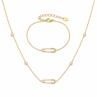 Ensemble collier et bracelet en zircon avec pendentif en acier inoxydable en forme de trombone