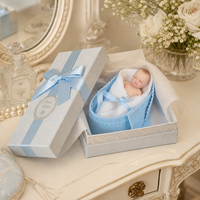 4 Zoll Silikon Reborn Babypuppe Schlafendes Pucktuch Blaue Tragetasche Satin-Schleife Neugeborenen-Puppe für Rollenspiele