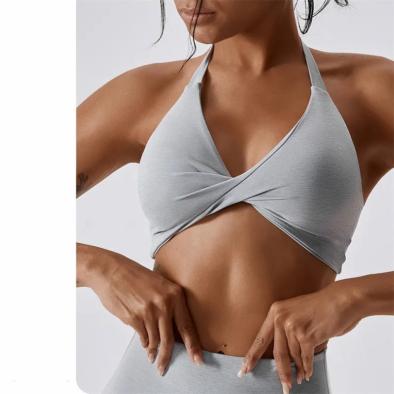 OEM Sportswear Custom Logo New Arrival Women Padded Nude Yoga Hanging Neck Twisted Bra Fitness Sexy Blank Sports Bra For Women