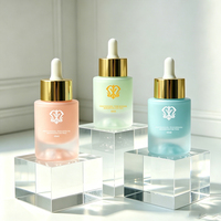 Flacon compte-gouttes rond en verre de 40 ml avec pipette à tête en caoutchouc pour l'aromathérapie, logo personnalisé