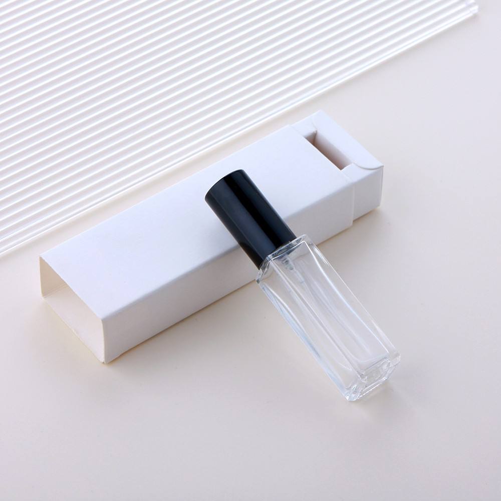 Clear glass spray bottle + black cap + white box
