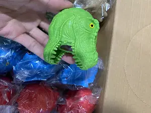 Descomprimir cabeza de dinosaurio pellizco música descomprimir Animal apretar bola TPR pegamento suave ventilación apretar bola juguete al por mayor