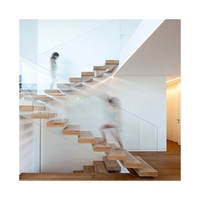 Escalier intérieur moderne en bois sur mesure, flottant, droit, cantilever avec garde-corps à câbles, marches en bois pour intérieur
