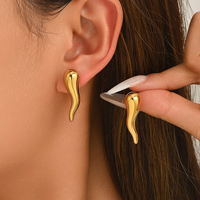 Boucles d'oreilles pendantes abstraites à contour lisse, forme incurvée polie, tendance, pour le quotidien et les soirées