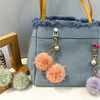 Porte-clés et pendentif de sac en peluche douce et luxueuse avec perle, design bonbon frais Journée de la Terre, pour voiture et étui d'écouteurs