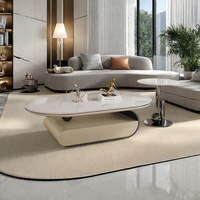 Table basse ovale moderne en ardoise avec base en acier inoxydable, bords arrondis et double tiroir de rangement pour salon
