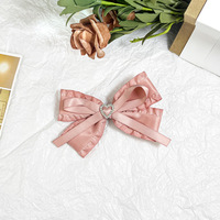 Accessoires pour femmes Pinces à cheveux avec nœud papillon et breloque en forme de cœur