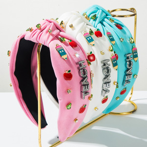 Diadema de moda para el regreso a clases con nudo de diamantes y dijes de manzana y lápiz para adolescentes - Product Image 1