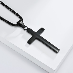 This unisex <b>titanium</b> steel cross necklace features a unique geometric design and a colorfast cross pendant. - Product Image 4