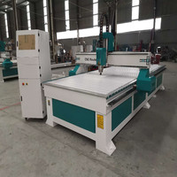 Équipement CNC de sculpture sur bois 1325 avec garantie d'un an pour la production en petite usine de travail du bois