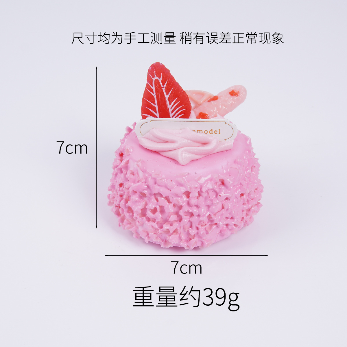 Imán para nevera con forma de pastel rosa.