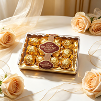 Ensemble de chocolats à la truffe fourrés aux noisettes, emballés dans un coffret doré haut de gamme, RISHDENE, élégante boîte cadeau transparente