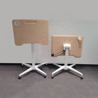 Bureau ergonomique en fer avec réglage pneumatique de la hauteur, roulettes mobiles, plateau rabattable à 90°, design moderne et compact, idéal pour usage commercial