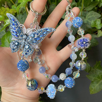 Breloque de téléphone papillon bleu foncé avec gros strass et perles, lanière de poignet pour sac, bijou artisanal lourd, cadeau pour femme