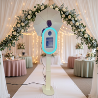 Photomaton portable pour iPad avec impression instantanée et partage sur les réseaux sociaux, idéal pour les mariages, les fêtes et les événements