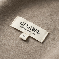 Étiquette tissée personnalisée en coton gros-grain avec logo de marque privée, pliée au centre, à coudre sur les vêtements