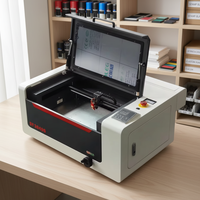 Graveur laser CO2 de haute précision, fabricant de tampons en caoutchouc, machine CNC de table refroidie à l'eau, moteur pas à pas pour usage domestique, grave