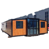 Maison conteneur en acier déployé polyvalent de 40 pieds à double aile Installation rapide pour immeuble de bureaux Salon d'hôtel en bois