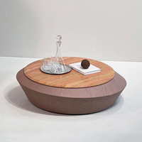 Table basse ronde de luxe moderne avec plateau en marbre rouge naturel et base en placage de bois noir, profil bas, pour salon